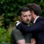An awkward-looking embrace between Macron and Zelenskyy