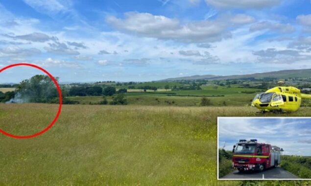 A helicopter crashes into a field near a tourist park, killing two people