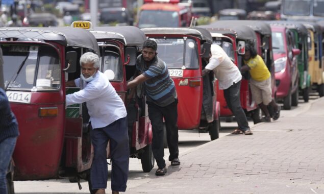 Tea and buns served to people waiting for petrol by Ex Lankan cricketer