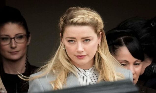 Amber Heard strikes up a conversation with a fishmonger while grocery shopping
