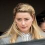 Amber Heard strikes up a conversation with a fishmonger while grocery shopping