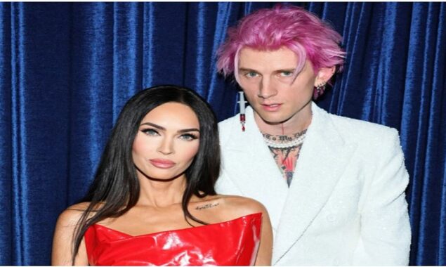 Machine Gun Kelly fashions blood filled syringe earring with fiancée Megan Fox
