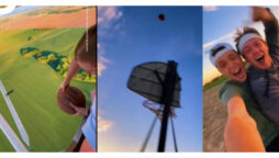 Watch video: Teen shots basketball from plane into moving hoop