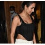Malaika Arora looks stunning in a black crop top and white slacks