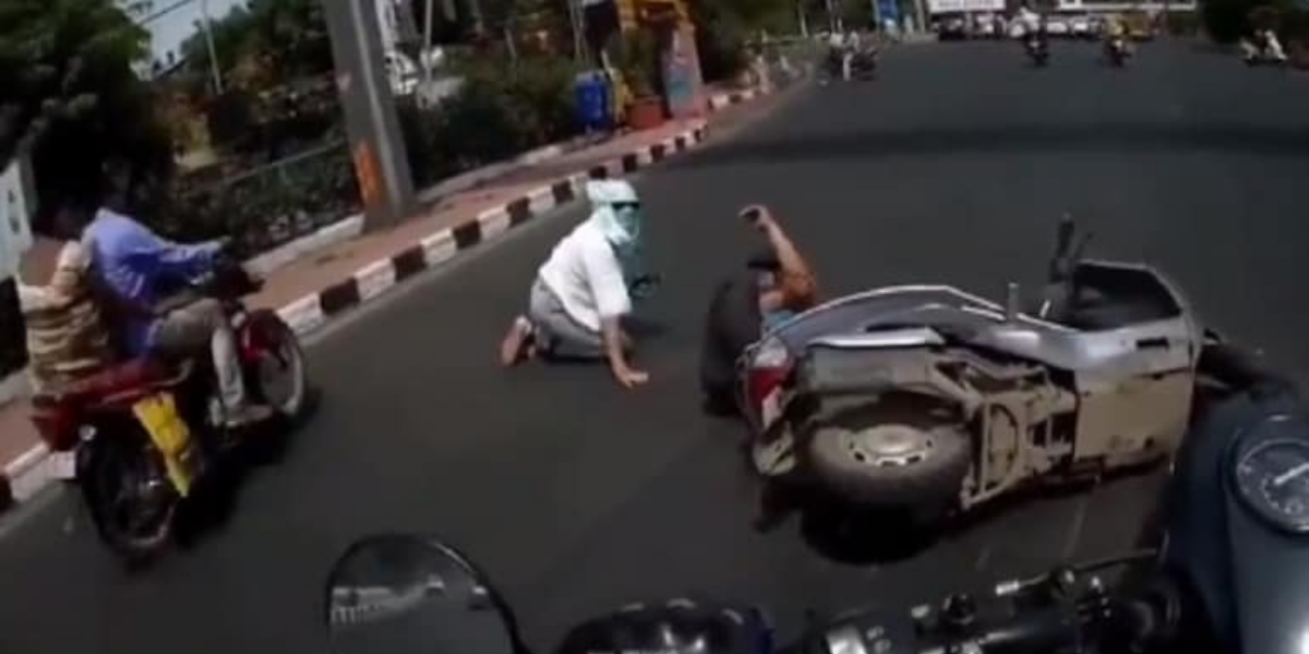 The camera saves man when a woman falls off scooter and blames him!