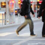 An automobile clashes with pedestrians