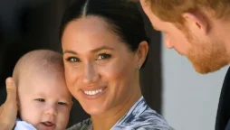 Prince Harry and Meghan Markle with son