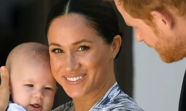 Prince Harry and Meghan Markle with son