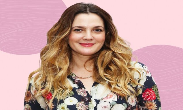 Drew Barrymore hammers at the wall in new home makeover video