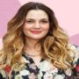 Drew Barrymore hammers at the wall in new home makeover video