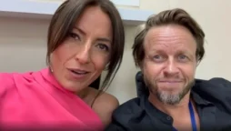 Davina McCall cuddles close to her rarely-seen beau Michael Douglas while looking stunning in an off-the-shoulder outfit