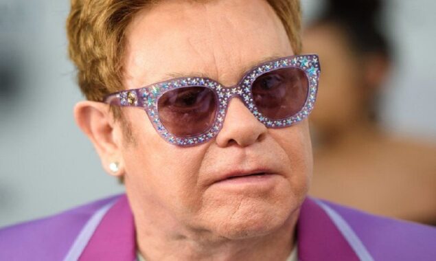 Sir Elton John answers to fans after being photographed in a wheelchair, saying, ‘I’m in great shape.’