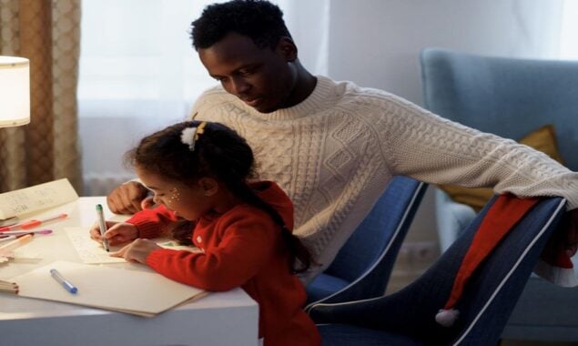 Dad learns to read and write from his daughter