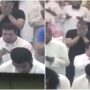 Man with Down syndrome offers tissues to a man who is sobbing during a prayer meeting