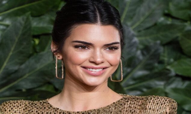 Kendall Jenner flaunts her enviable physique in a tiny yellow top
