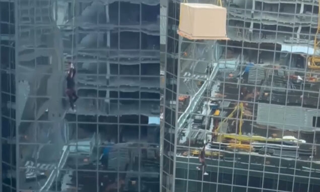 Shocking viral video shows construction worker dangling from crane