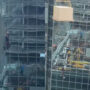 Shocking viral video shows construction worker dangling from crane