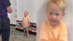 Video of a toddler taking his passport photo gone viral