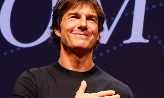 Tom Cruise watches the action at Silverstone while celebrating 60th birthday