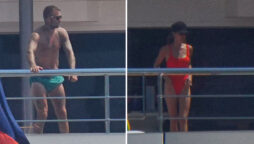 Victoria Beckham wears red swimsuit while David goes topless