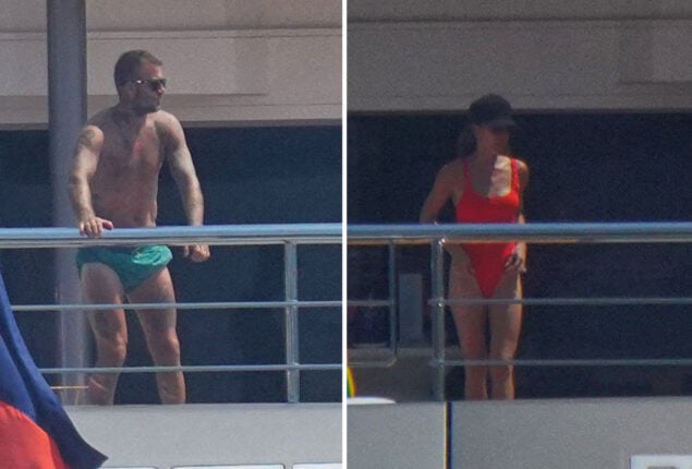 Victoria Beckham wears red swimsuit while David goes topless