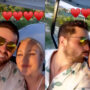 Baker Mayfield and his wife Emily embrace as they go to Carolina