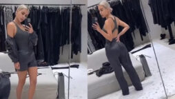 Kim Kardashian displays her incredibly small waist in a bodysuit and track trousers while inside her $60 million LA mansion’s spacious closet
