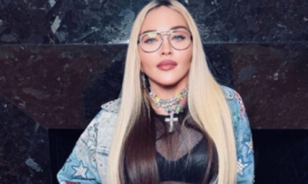 Madonna steps out for dinner in black lace top and shorts tights