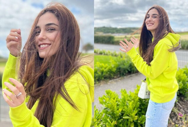 Maya Ali enjoys windy weather wearing neon yellow hoodie in UK