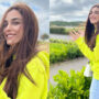 Maya Ali enjoys windy weather wearing neon yellow hoodie in UK