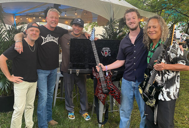 Joseph Quinn performs with Metallica at Lollapalooza