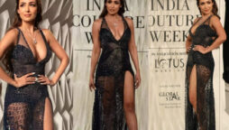 Malaika Arora Steps Out In A Black Embellished Thigh High Slit Gown walks the ramp for designers 