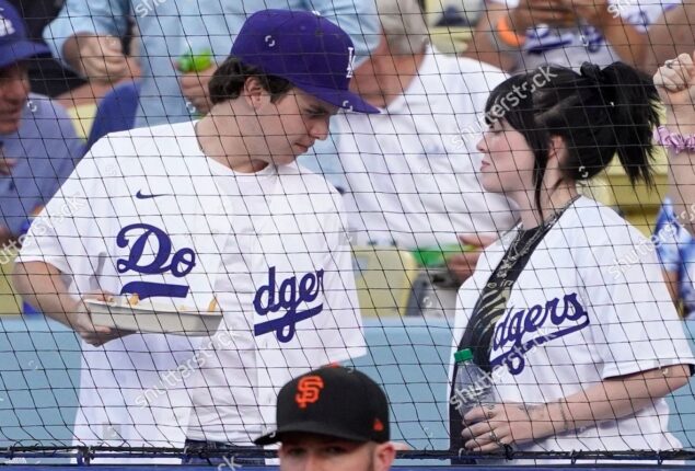 Billie Eilish puts on a sporty performance with brother Finneas at a local baseball game