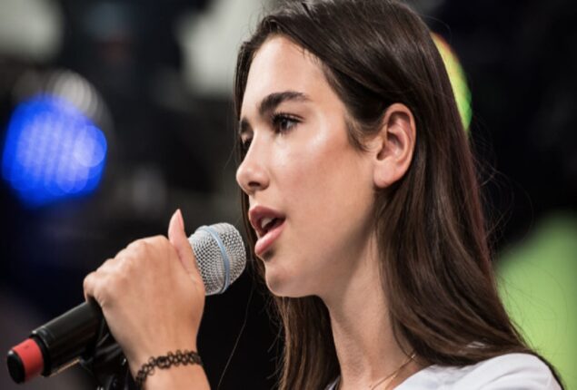 Dua Lipa stuns in a thigh-skimming miniskirt and matching jacket in photos