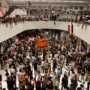 Demonstrators swarm Baghdad’s parliament, cursing Iran