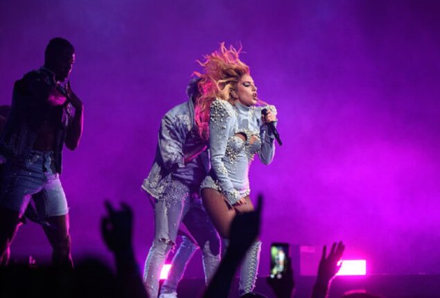 During her world tour, Lady Gaga avoids an object thrown at her onstage