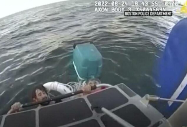 Father and son hanging to a water cooler saved from Boston Harbor