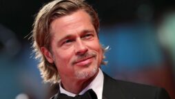 Brad Pitt denies retirement claim as he dons bright suit on red carpet