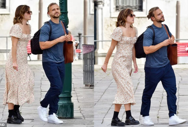 Emma Watson steps outside with her beau Brandon Green