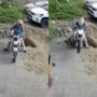 Watch: Man falls into huge pit while driving his bike backwards