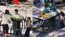 Watch: School kids helps woman to push loaded fruit cart