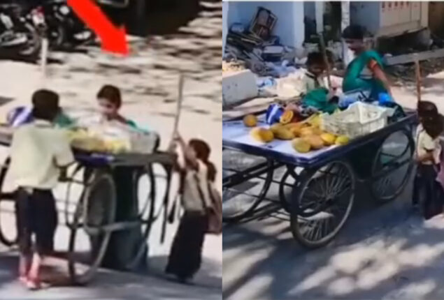 Watch: School kids helps woman to push loaded fruit cart