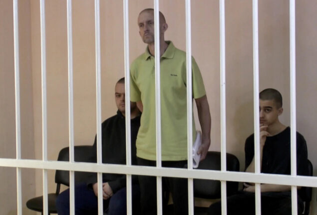 Russian occupiers set up cages in Mariupol to hold a “show trial” for prisoners of war