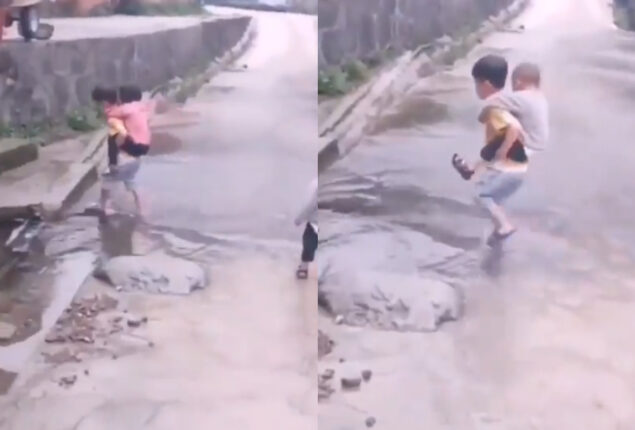 Viral Video: Little boy carries his siblings through puddle