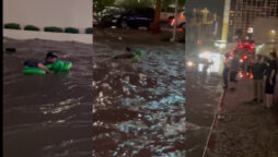 Pool float man swims through flooding Las Vegas roadways