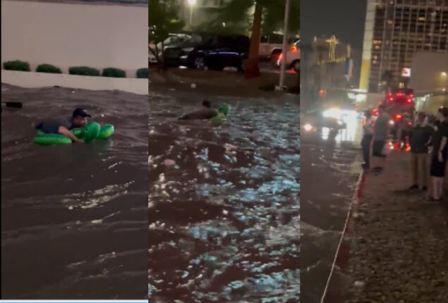 Pool float man swims through flooding Las Vegas roadways