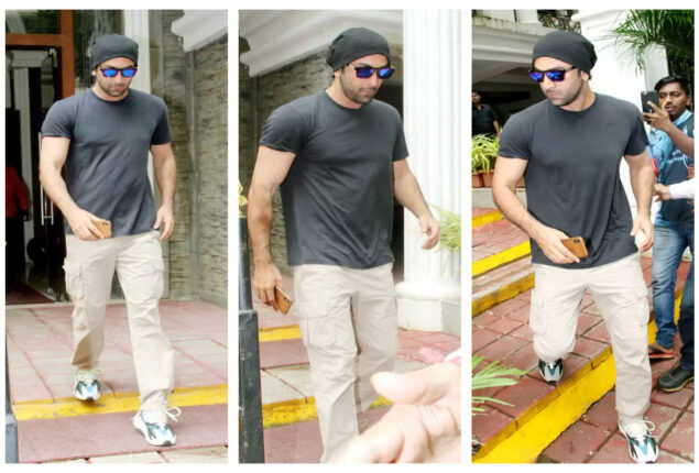 Ranbir Kapoor poses for photos in front of Karan Johar’s office