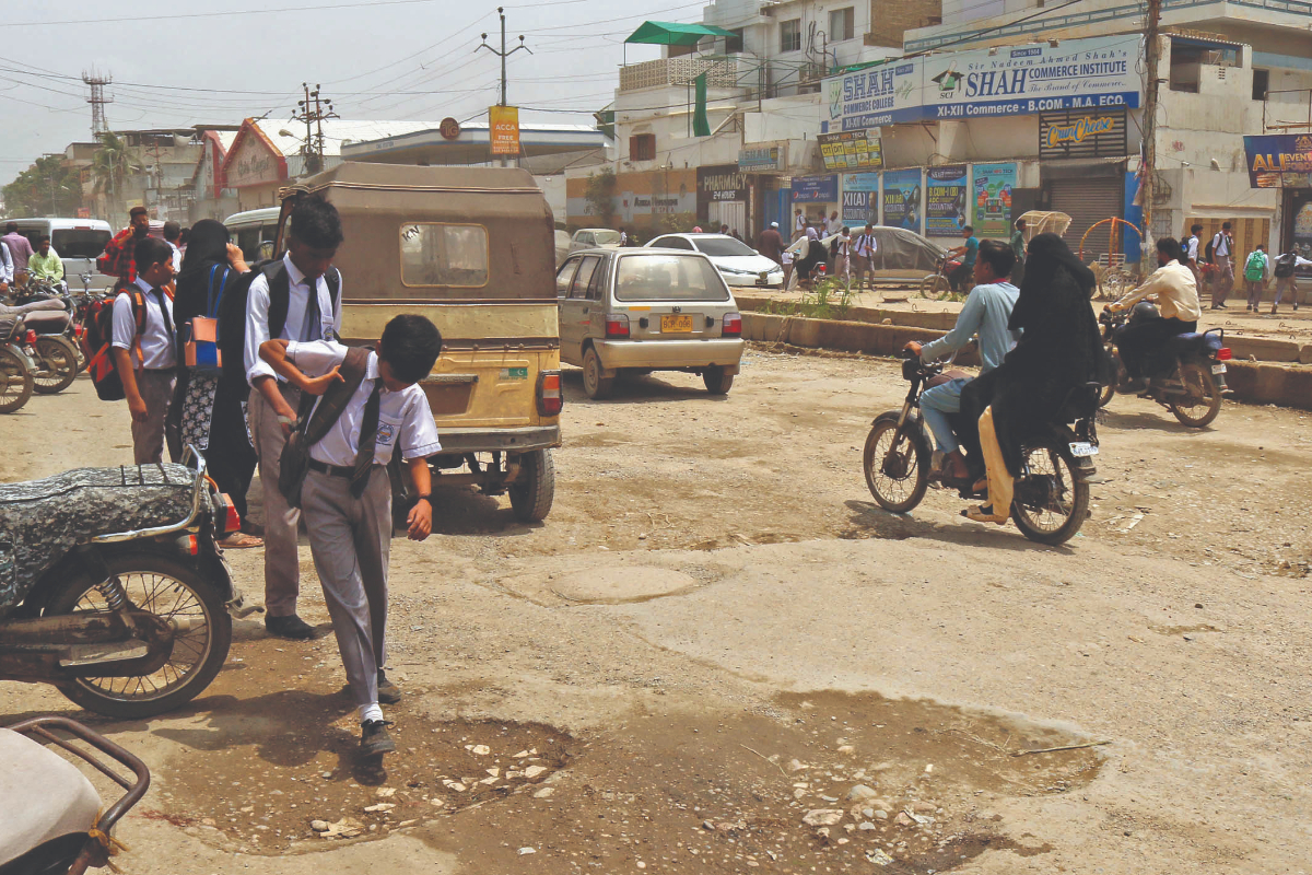 Rain reduces Karachi roads to mud tracks