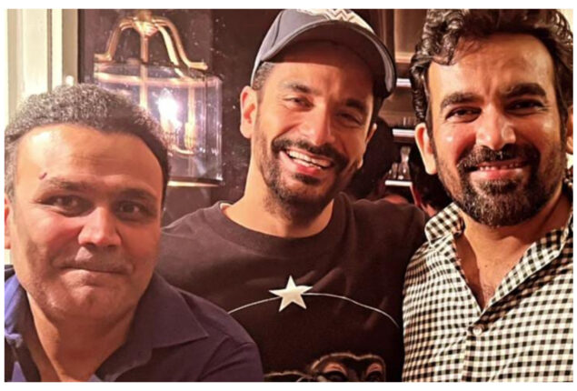 Angad Bedi poses with former cricket players Virender Sehwag and Zaheer Khan