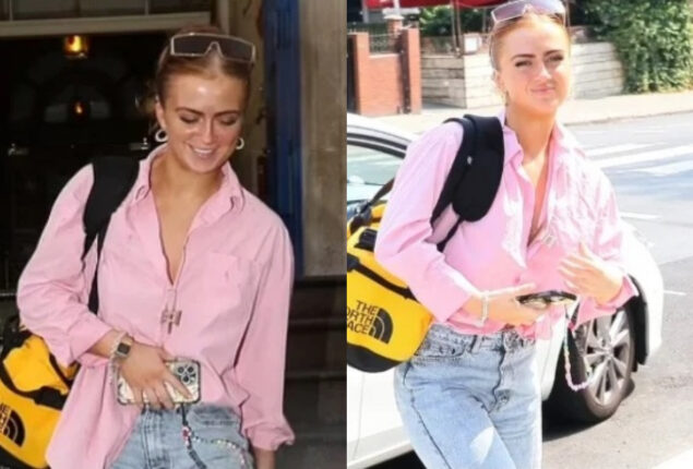 Maisie Smith spotted in baby-pink button-down shirt and white ripped trousers